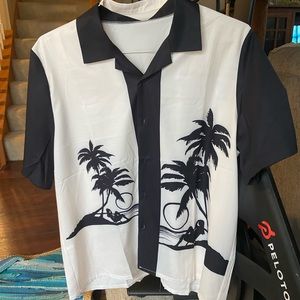 Three men’s camp shirts. All are the same size.